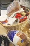 A basket from Mat-Su College included everything needed for the
typical turkey feast, as well as a gift certificate to a local
grocery store and materials about continuing education.