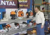 Jim Johnson, co-owner of APR Rental in Palmer, discusses various models of chain saws while manning the APR Rental booth at the 2013 Mat-Su Outdoorsman Show Saturday. The show continues today
