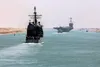130818-N-PW661-019 SUEZ CANAL (Aug. 18, 2013) The guided-missile cruiser USS San Jacinto (CG 56) follows the aircraft carrier Harry S. Truman (CVN 75) during a Suez Canal transit with the Har