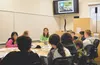 Aquatic Ecologist Dr. Carol Ann Woody teaches a group of the 54 students from the Mat-Su Borough School District about fisheries in Alaska as part of the Alaska Native Science and Engineering