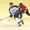 Colony's Chris Crosta cuts across the ice to receive a pass
during Saturdays' game against Kenai. TIM BRODT/Frontiersman