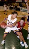 Wasilla senior Chandice Cronk tries to pull the ball away from
Lathrop senior Erika Stevens during the Warriors' 45-43 win over
the Malemutes in the third-place game of the 4A girls' basketba