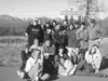 Above, Colony JrROTC cadets take time to enjoy the sun during a
trip to Denali Park. At right, an American flag waves through the
opening on a monument dedicated to those who served in the U.