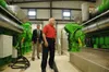 Assistant Secretary of the Navy, the Honorable Dennis V. McGinn (right), Energy, Installations and Environment, tours the landfill gas-to-energy project with Fred Broome, director, Installati