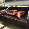 Jodie Anderson and Randy Cole, Palmer residents, have started a mobile catering business, Laughing Raven Catering, with a specially made 8-foot cooker, including both grill and smoker. Active
