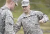 The Alaska National Guard's Pfc. Sparks gets training from Sgt.
Grimsley during Saturday's exercise near Summit Lake in the Hatcher
Pass area. (ROBERT DeBERRY/Frontiersman) Robert DeBerry