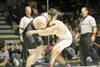 ROBERT DeBERRY/Frontiersman Wasilla Warrior Jed Johnson locks
arms with North Pole's Jackson Collins during the 285 lb. final at
the state wrestling championship tournament Saturday night.