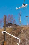 In an impressive bit of flying by Soloy Helicopters' Chief Pilot John Jr. Baechler of Iliamna, a helicopter was used to string wire for a new Matanuska Electric Association power line along t