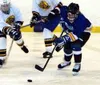 Valley Hospital's Jeannie Hebert (right) takes the puck around
UAA defenders in the first period of Saturday's game against the
Seawolves at Brett Memorial Ice Arena. Photo by TIM
BRODT/Front