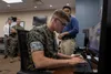 U.S. Marine Corps Lance Cpl. Matthew R. Gignac, an air-support operations operator with Marine Air Support Squadron (MASS) 1, operates a prototype of the Gaming Environment for Air Readiness 