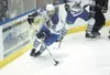 Palmer junior captain Ivan Good, above, skates the puck through
the corner for the Moose during a recent game. Good was named the
North Star Conference Player of the Year. (ROBERT
DEBERRY/Fro