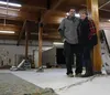 Michael and Karen Cole stand behind a crack in the floor of the old location of their Kash’s Carpet Warehouse. The location sustained significant damage during the Nov. 30, 2018, earthquake, 