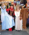 CASEY RESSLER/Frontiersman Alayna Sucevich and Adele Morgan of
Valley Rental Center show off some of the costumes the store is
offering this year.