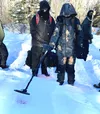 Mike O’Hara, Office of Special Investigations, Detachment 631 special agent and Staff Sgt. Jaimie Doney, 673rd Security Forces Squadron, use a metal detector to search for a bullet casing bur