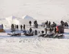 Divers are lowered into Matanuska Lake Monday evening to recover what law enforcement officials believe is the body of missing Anchorage barista Samantha Koenig. (Robert DeBerry/Anchorage Pre