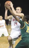 Wasilla’s Wade Stahle drives past Service’s Farimang Touray
during Thursday’s first-round game at the ASAA/First National Bank
4A State Champion-ships in Anchorage. (ROBERT
DeBERRY/Frontiersm