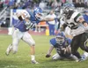 ROBERT DeBERRY/Frontiersman Palmer senior John Scoresby
stiff-arms Colony’s Trey Farber during Friday’s game at Palmer High
School’s Machetanz Field.