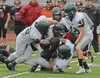 Colony defenders stop Juneau-Douglas running back Manase Maake during Saturday's 48-0 Knights win over the Crimson Bears in Juneau. KLAS STOLPE | JUNEAU EMPIRE