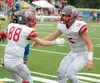 Wasilla receiver Riley Fuller celebrates with quarterback Aeron Milliron after a touchdown during a 42-20 loss to Bartlett Aug. 12 in Anchorage. Matt Hickman/Frontiersman