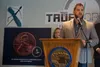 Alaska Health Commissioner Adam Crum, speaking about fentanyl at a May 3 news conference in Wasilla, uses a chart to show that even a tiny amount of the synthetic opioid can be fatal. Behind 