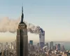 The World Trade Center burns behind New York City’s Empire State Building, Sept. 11, 2001. Both towers were attacked as a result of a highly-coordinated al-Qaida plot. (AP photo by Marty Lede