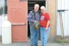 Photo courtesy of West Valley Family Church Pastor Paul Trissel
and his wife, Pam, pose outside their new church home — the site of
the former Showgirls exotic dance club on the Parks Highway