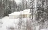 ROBERT DeBERRY/Frontiersman One of six homes the borough has
bought sits boarded up ready to be tore down along the Bogard Road
extension route. The borough has spent about $2 million on
righ