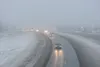 Traffic moves along the Parks Highway near Trunk road under foggy conditions and drizzle Friday morning. ROBERT DeBERRY/Frontiersman.com