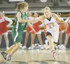 ROBERT DeBERRY/Frontiersman Wasilla senior Jenna Johnson moves
the ball past Colony’s Tara Garrod during a semifinal state
basketball game.