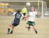 ROBERT DeBERRY/Frontiersman Colony freshman Brandy Gallagher,
right, goes for a loose ball during the Knights’ game against the
Soldotna Stars Friday at Colony High School.