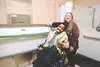 Judy and Eric Edwards pose for a photo at a ribbon cutting ceremony for a new universal changing station installed on the first floor of the Alaska State Capitol on Mar. 19, 2026. Corinne Smi