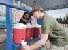 Onaleea Belair and her brother Paul serve up lemonade at their Lemonade Day stand along the Parks Highway in June 2013. The brother and sister entrepreneurs said they planned to donate a port