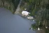 Josh Shaver moved his house from 1000 N. Old Glenn Highway Wednesday to a parcel of property he owns along the Little Susitna River. Jim Stocker