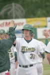 MATT TUNSETH/Frontiersman Mat-Su Miners third baseman Ben Price
is congratulated by teammates following his game-winning single
Sunday evening against Three Rivers (Ore.) at Hermon Brothers F