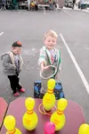GREG JOHNSON/Frontiersman — Cole Sheldon, 6, tosses rings over
bowling pins Saturday at the Fall Festival at Sportsman’s
Warehouse. His younger brother Wyatt, 4, looks on.