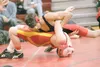 ROBERT DeBERRY/Frontiersman Houston Hawk Cass Melin attempts to
pin West Valley's Matt Goodwin during the Mid-Alaska Conference
Tournament.