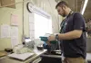 Brandon Durocher, Defense Logistics Agency disposition services, reads the guidelines for the certified scale at Joint Base Elmendorf-Richardson, Alaska, Nov. 3, 2017. The DLAs’ disposition s