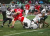The Colony Knights defense wraps up Wasilla quarterback Colton Lindquist during a 14-0 win over the Warriors Friday. Courtesy of Bruce Eggleston/matsusports.net