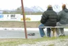 MATT TUNSETH/Frontiersman 12-year-old Carly Meacham circles the
track Sunday during a test and tune session at North Star Speedway
in Wasilla as her grandmother Sheilah Eral, left, and mother