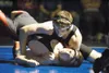 ROBERT DeBERRY/Frontiersman Colony junior Simon Root tries to
pin Houston’s Jake Davis during the 170-pound final Saturday at the
Lancer Smith Memorial wrestling tournament at Palmer High
Sch