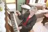 GREG JOHNSON/Frontiersman Gerry Keeling plays the vintage 1895
piano at the Colony House Museum on a rainy Thursday afternoon. The
museum is a testament to the original colonists who settled 