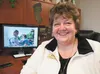 Janice Lobaugh sits in her Wasilla office with a photograph on her computer screen of the reunion between her and her biological son, whom she gave up for adoption 30 years ago. Lobaugh was r