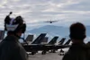 Members assigned to the Marine Fighter Attack Squadron 533 (VMFA-533) watch as an aircraft launches from the flight line during exercise Northern Edge 2025 at Joint Base Elmendorf-Richardson,