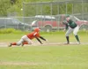 ROBERT DeBERRY/Frontiersman Wasilla junior Chris Bydlan dives
back to first during Saturday’s game against the Colony
knights.