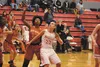 Wasilla High post Mallory Wheeler blocks a basket against West Valley. Mallory has helped the girls Warrior basketball team remain undefeated in the Northern Lights Conference. Mallory is the