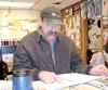 Copper River Record Production Manager Jim Crigger takes care of
the books, ordering and selling at the slaughter house facility, in
addition to providing USDA training to inmate-employees an