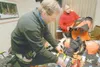 ROBERT DeBERRY/Frontiersman SigurjÃ“n Pétursson, left, and wife
ThÃ“ra HrÃ¶nn NjÃ¡lsdÃ“ttir lay their Iron Dog gear out on the bed
for repacking Thursday at the Best Western Lake Lucille Inn 