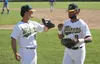 Mat-Su infielder Brandon Chinea bumps fists with outfielder Quin Cotton as Cotton jogs to the dugout during a recent game against the Anchorage Glacier Pilots. Cotton has been named the Alask