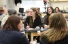 Palmer High School Science Bowl team captain Kimberly McDowell, center, laughs with teammates Annie Wang (right) and Elliot Mayfield during the state competition at Mat-Su Career and Technica