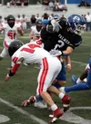 Palmer's Corbin Gerkin breaks a tackle against Juneau-Douglas. Bruce Eggleston/matsusports.net